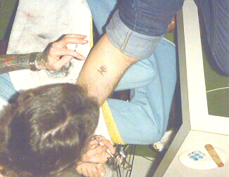 TattooNeil Tattooing 2nd Mushroom on Gregg Allman's leg.